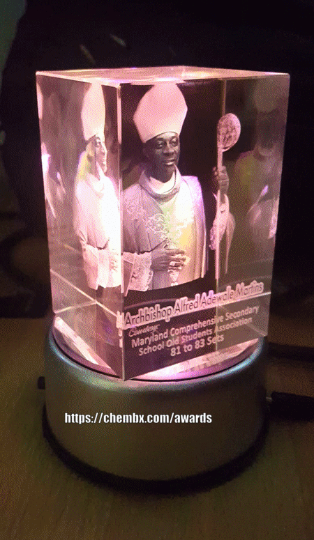 Personalized 3D glass award cube with spinning base for events in Lagos and Abuja