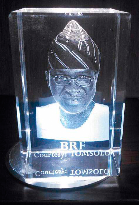 Premium 3D crystal trophy with custom logo engraving and motion display stand